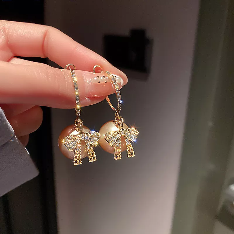 CHRISTMAS PEARL AND BOW EARRINGS - Image 2