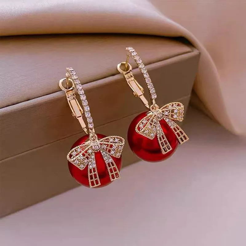 CHRISTMAS PEARL AND BOW EARRINGS - Image 3